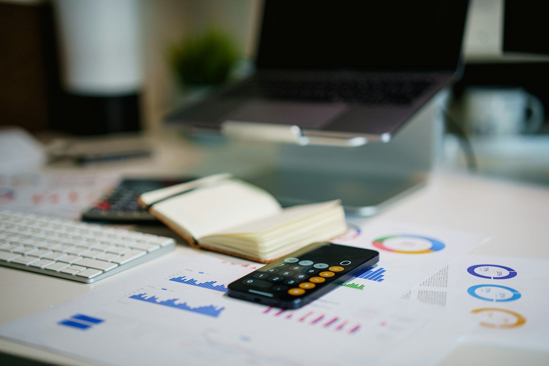 Agentic AI Banking training – workspace with laptop, charts and calculator